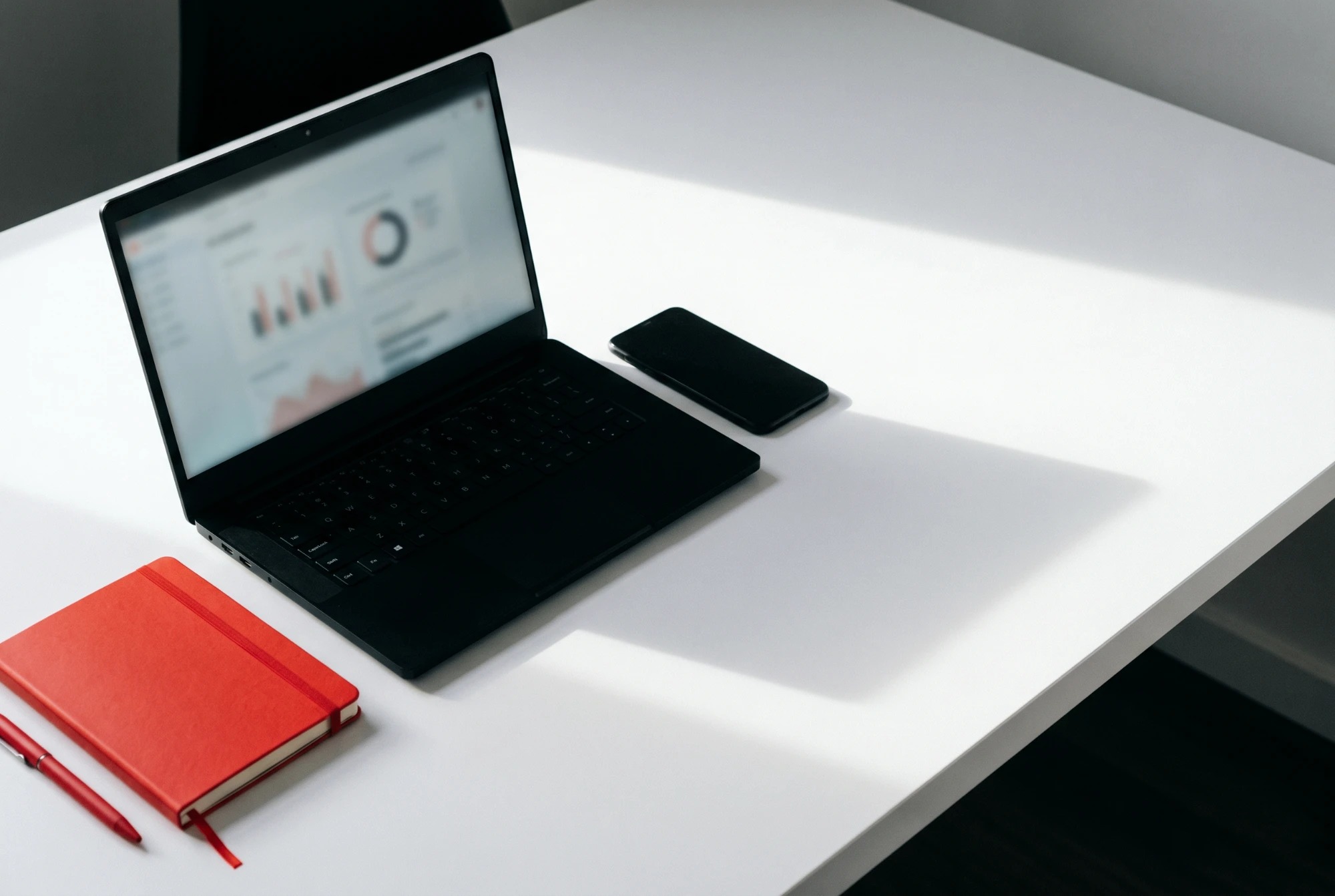 A workspace with a laptop showing an analytics dashboard